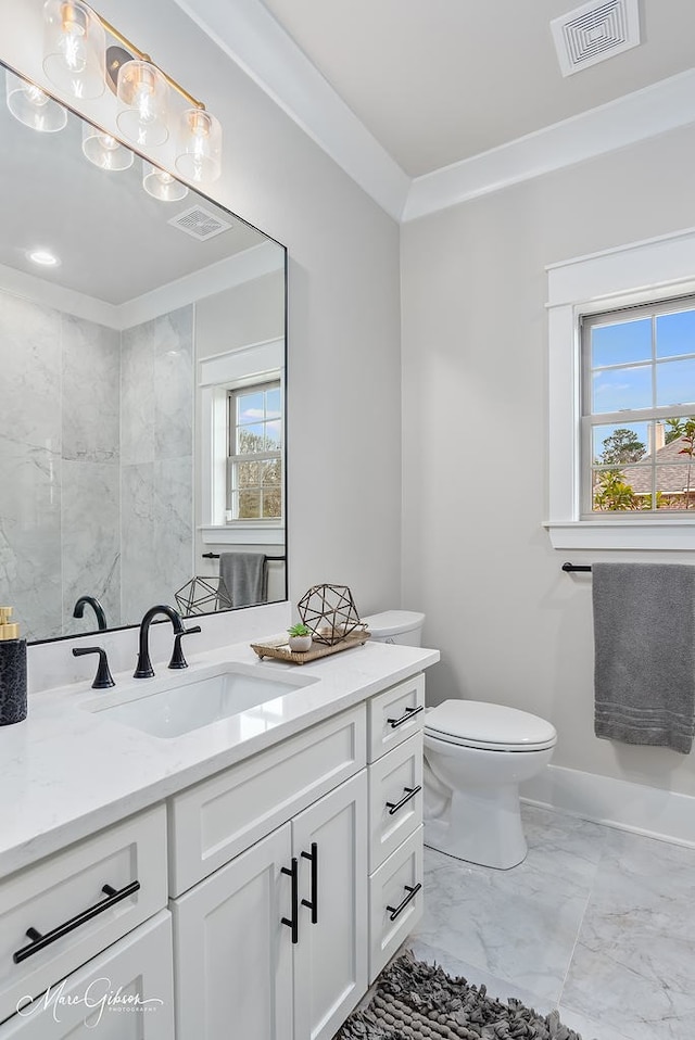 bathroom with vanity, toilet, visible vents, and marble finish floor