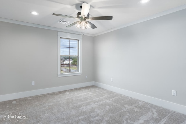 empty room featuring baseboards, carpet, a ceiling fan, and ornamental molding