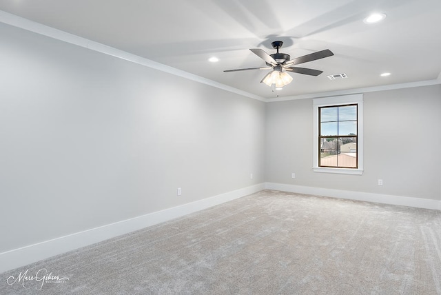 carpeted spare room with a ceiling fan, baseboards, visible vents, recessed lighting, and crown molding