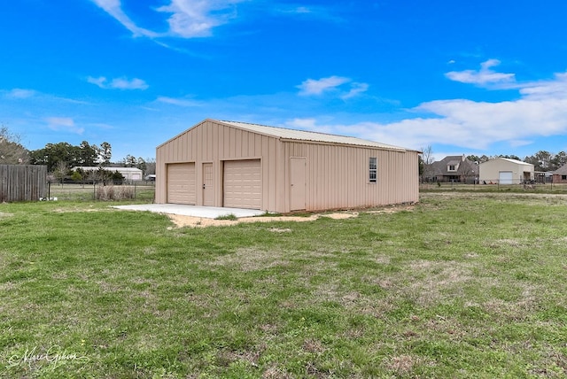 exterior space featuring an outbuilding and fence