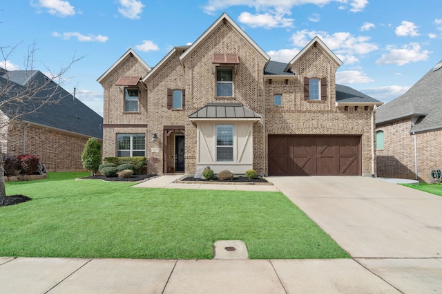 view of front of house featuring a garage, a front lawn, brick siding, and driveway