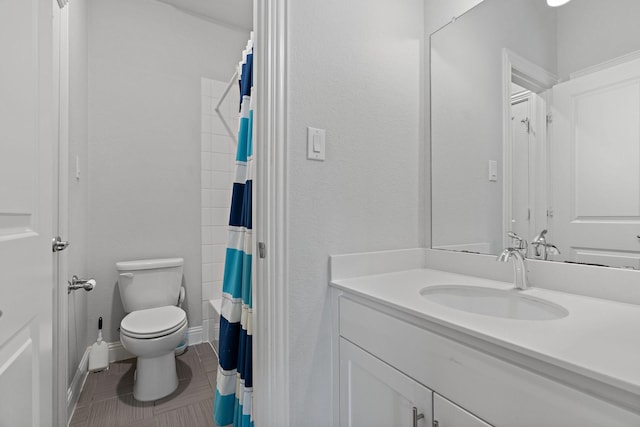 full bathroom with curtained shower, baseboards, toilet, tile patterned floors, and vanity