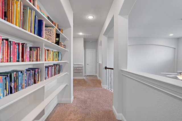 hallway with carpet flooring, recessed lighting, and baseboards