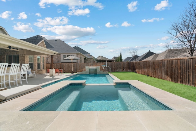 view of swimming pool featuring a ceiling fan, a patio area, a fenced in pool, and a fenced backyard