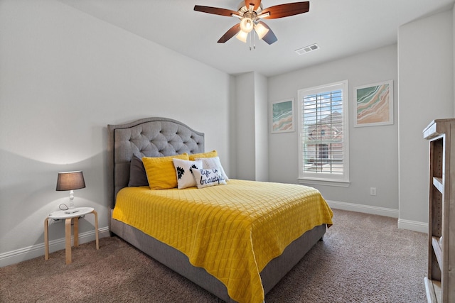 carpeted bedroom with visible vents, ceiling fan, and baseboards