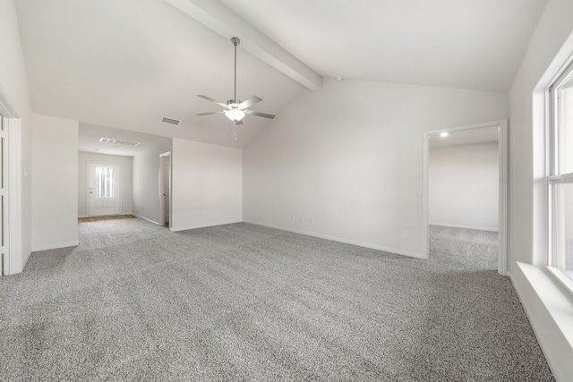 carpeted spare room featuring vaulted ceiling with beams, a ceiling fan, visible vents, and baseboards