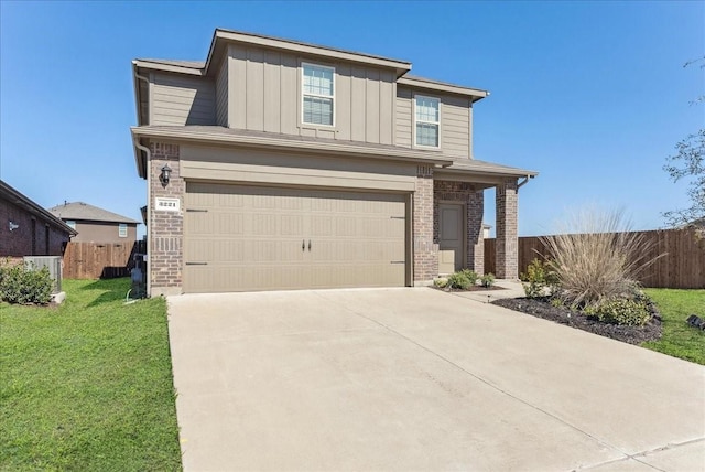 view of front of home with brick siding, board and batten siding, a front lawn, and fence