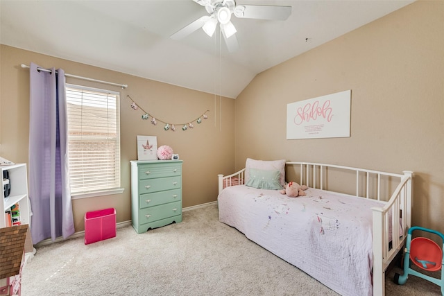 carpeted bedroom with baseboards, ceiling fan, and vaulted ceiling