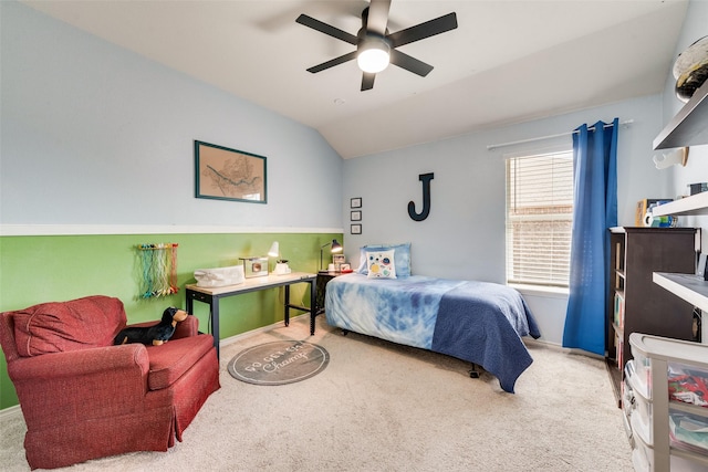 bedroom with ceiling fan, baseboards, carpet, and vaulted ceiling