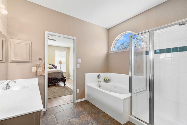 ensuite bathroom featuring a bath, a stall shower, vanity, and ensuite bathroom