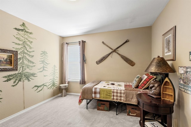 carpeted bedroom with baseboards