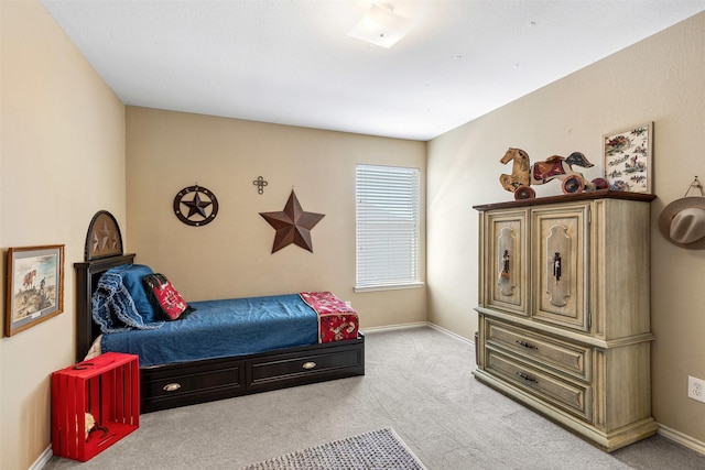 bedroom featuring baseboards and carpet floors