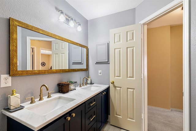 full bathroom with a sink and double vanity