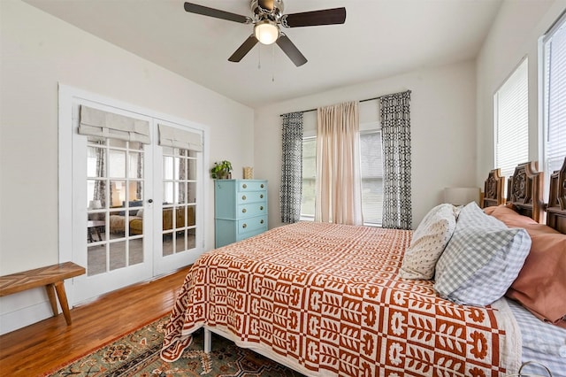 bedroom with a ceiling fan, wood finished floors, and french doors