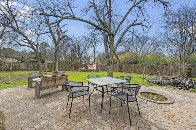 view of patio / terrace featuring outdoor dining space and a fenced backyard