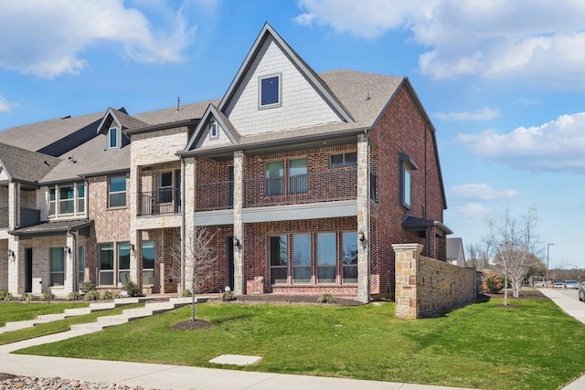 view of front of house with brick siding and a front yard