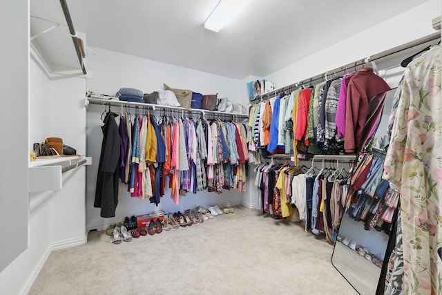 spacious closet with carpet floors