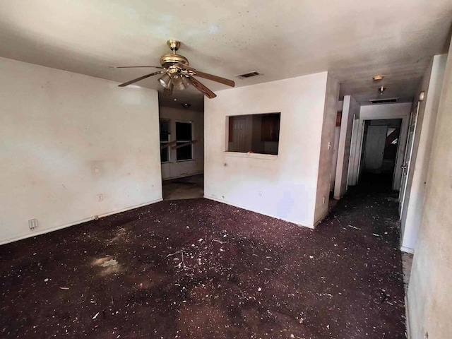 unfurnished room featuring carpet flooring, a ceiling fan, and visible vents