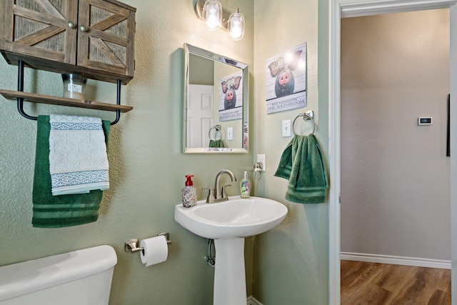 1513 Hidden Cove Ct, Allen, TX 75002 - bathroom featuring toilet, wood finished floors, and baseboards