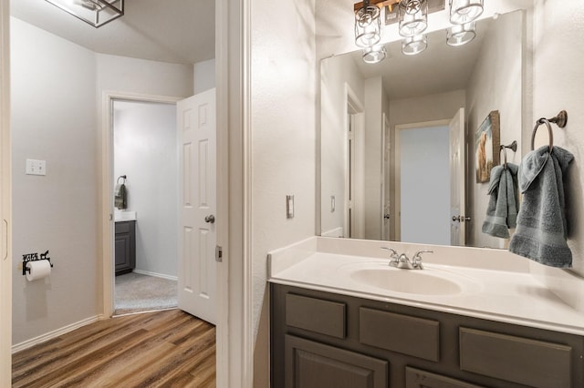1513 Hidden Cove Ct, Allen, TX 75002 - bathroom featuring vanity, wood finished floors, and baseboards
