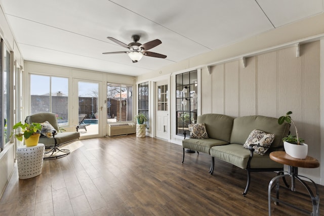 sunroom / solarium with a ceiling fan