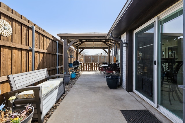 view of patio featuring a gazebo and a fenced backyard