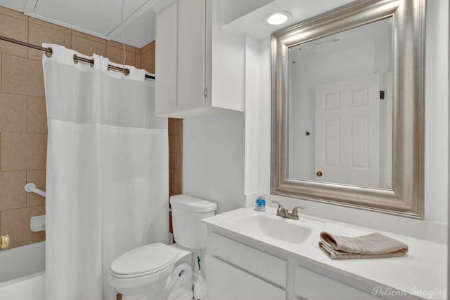 full bathroom with toilet, shower / tub combo with curtain, and vanity