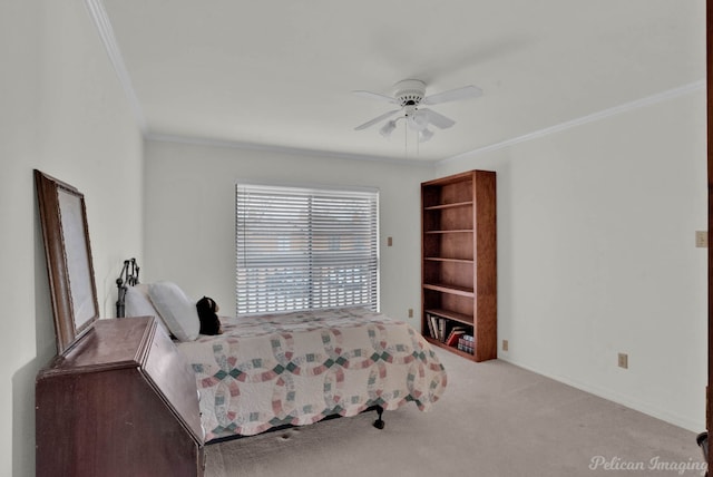 carpeted bedroom with ceiling fan and ornamental molding