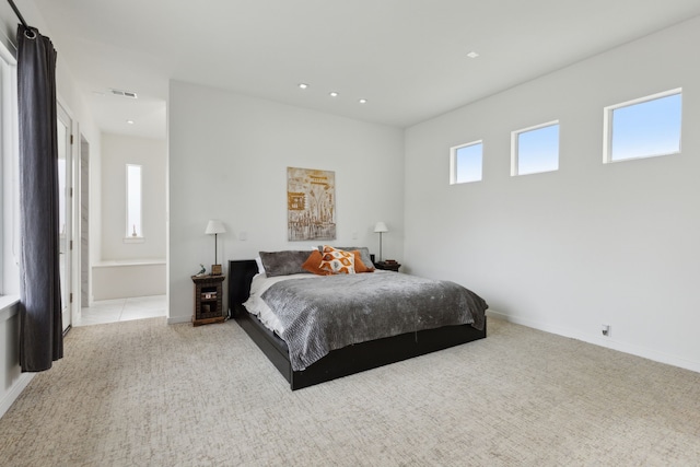 carpeted bedroom featuring recessed lighting, visible vents, multiple windows, and baseboards