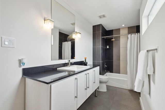 bathroom featuring visible vents, toilet, tile patterned floors, vanity, and shower / bathtub combination with curtain