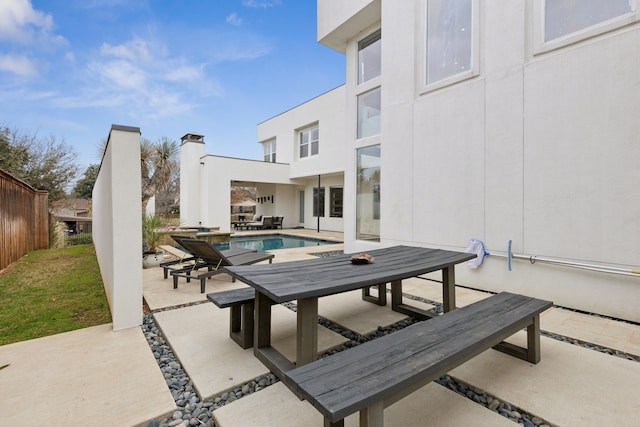 view of patio featuring a fenced in pool and fence