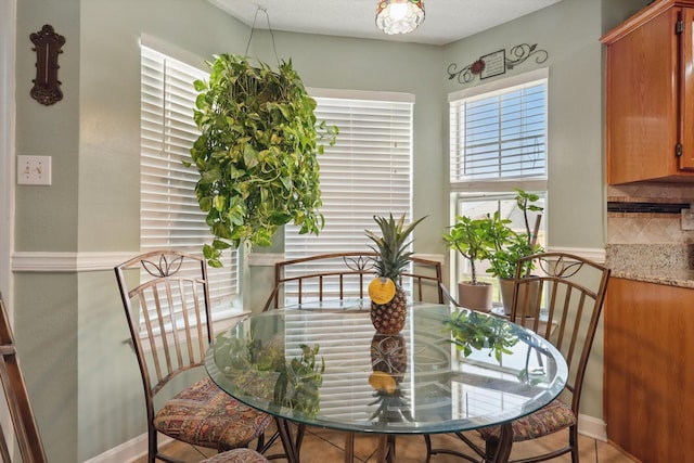 dining area featuring baseboards