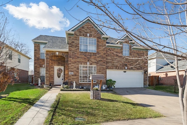 traditional-style house with brick siding, a garage, concrete driveway, and a front yard