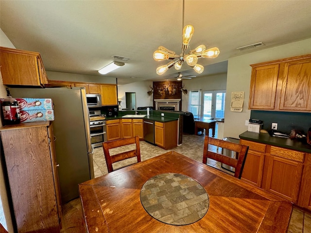 469 Streetman Rd, Royse City, TX 75189 - kitchen with a sink, stainless steel appliances, visible vents, and a peninsula
