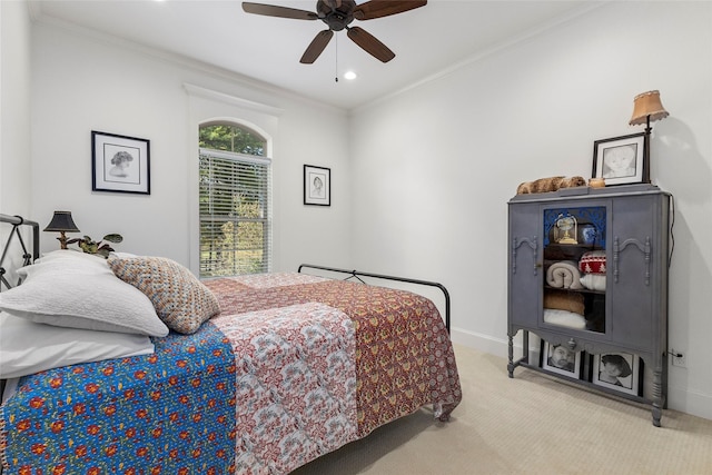 bedroom featuring baseboards, a ceiling fan, carpet, and ornamental molding