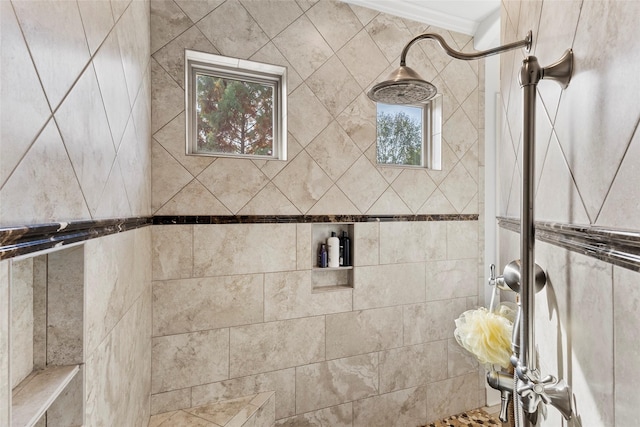 full bath with a tile shower