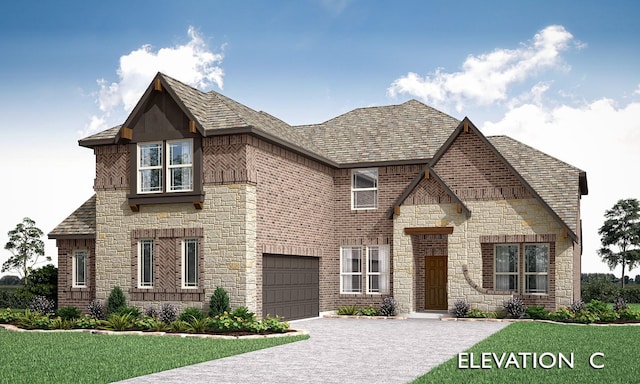 view of front of house featuring brick siding, driveway, an attached garage, and a front yard