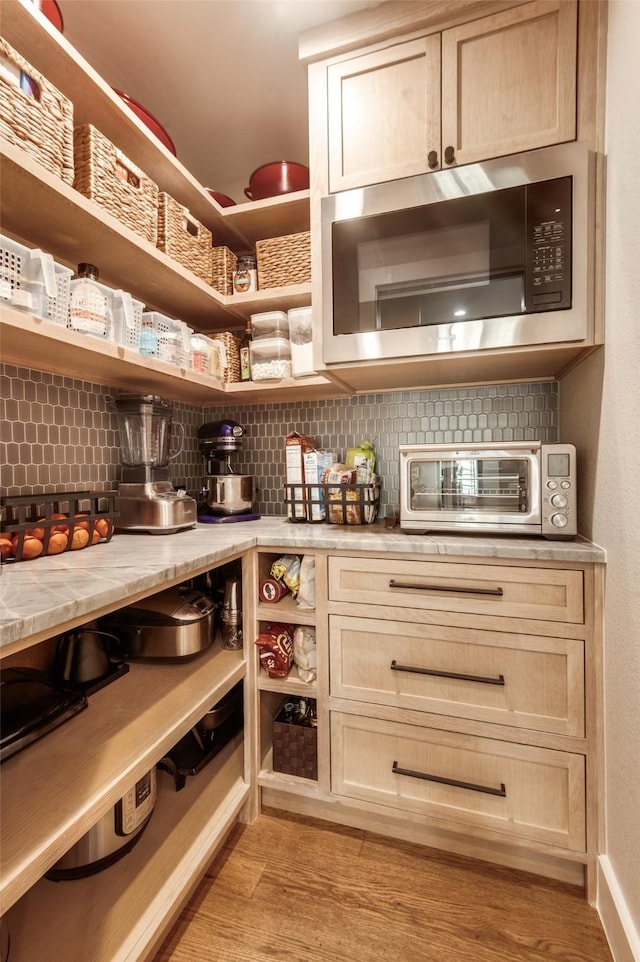 storage area featuring a toaster