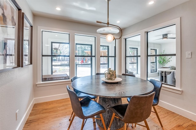 dining area featuring recessed lighting, baseboards, and light wood-style flooring