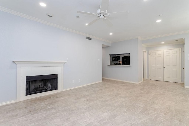 unfurnished living room featuring a tiled fireplace, a ceiling fan, visible vents, and ornamental molding