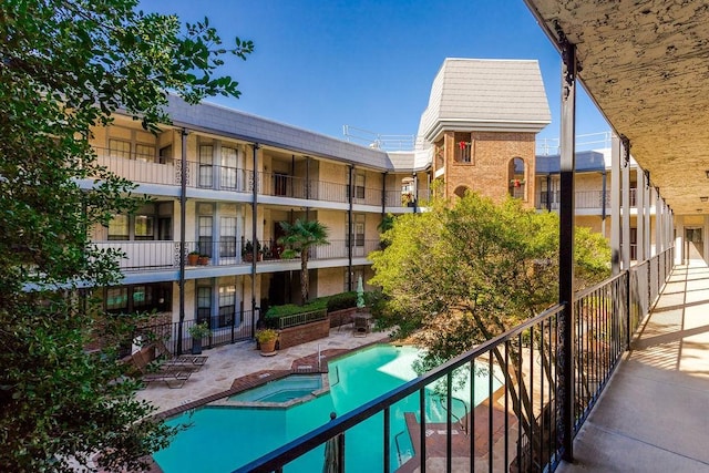 view of community with a patio and a pool