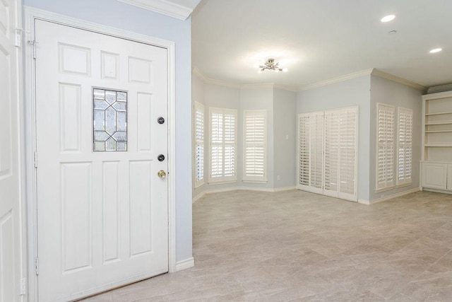 entryway featuring recessed lighting, baseboards, and crown molding