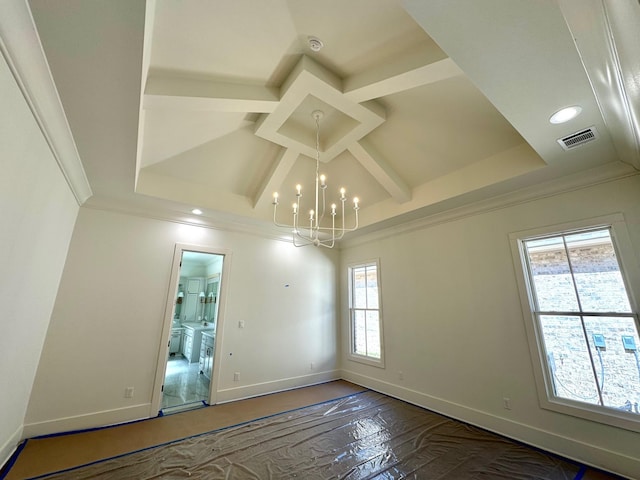 spare room with visible vents, a notable chandelier, coffered ceiling, crown molding, and baseboards