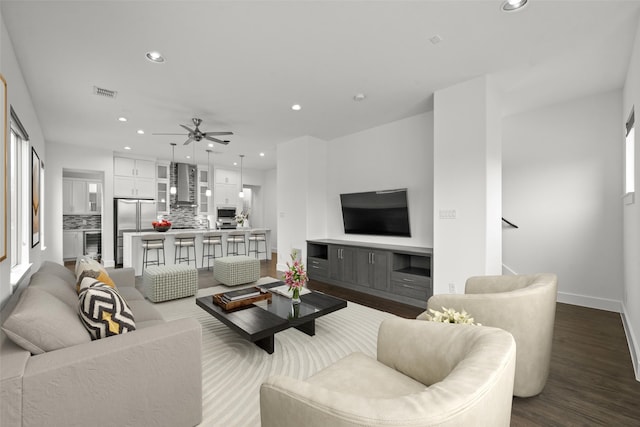 3012 Zenia Dr, Dallas, TX 75204 - living room with recessed lighting, dark wood-style flooring, and a ceiling fan