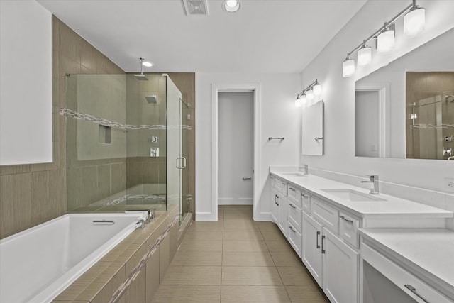 3012 Zenia Dr, Dallas, TX 75204 - full bathroom featuring a stall shower, double vanity, a bath, tile patterned floors, and recessed lighting