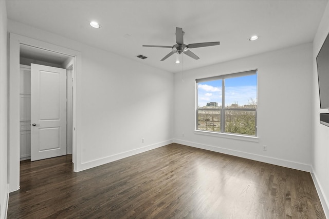 unfurnished room featuring visible vents, a ceiling fan, dark wood-style floors, recessed lighting, and baseboards