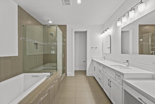 bathroom with a sink, visible vents, a stall shower, and a bath