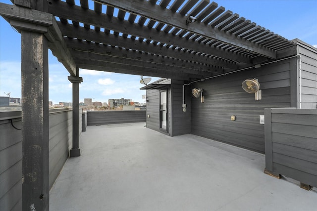 view of patio featuring a city view and a pergola