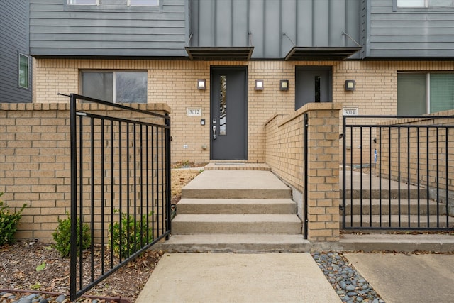 3012 Zenia Dr, Dallas, TX 75204 - doorway to property featuring brick siding and a gate