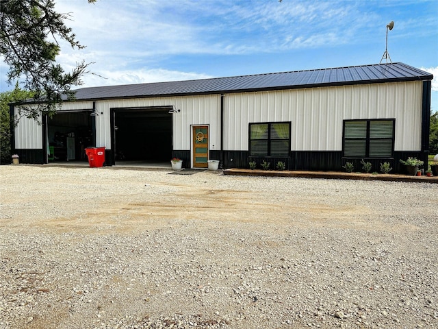 view of pole building featuring driveway